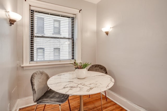 dining area with wood-type flooring