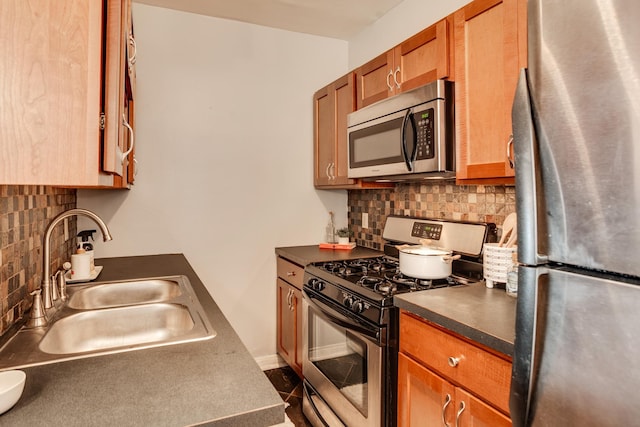 kitchen with sink, stainless steel appliances, and tasteful backsplash