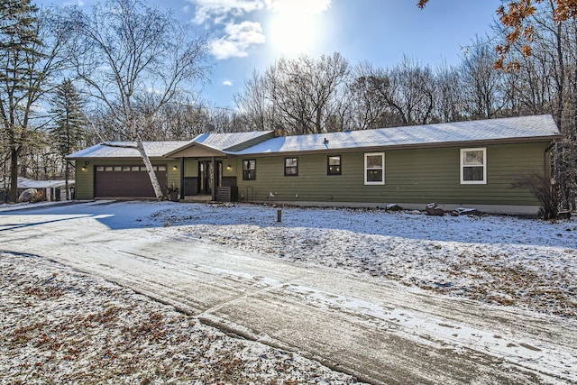 single story home featuring a garage