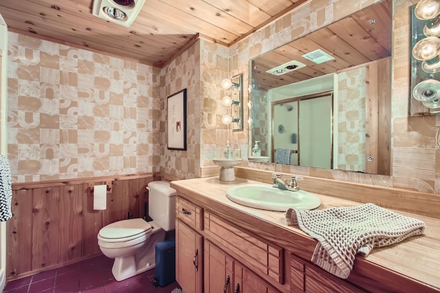 full bath featuring tile patterned flooring, toilet, vanity, wood ceiling, and a stall shower