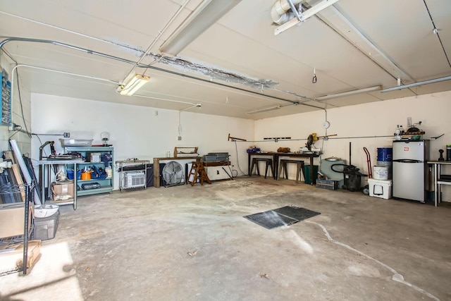 garage featuring freestanding refrigerator