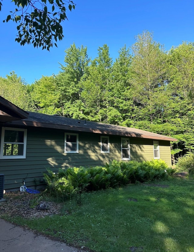 view of property exterior featuring a yard