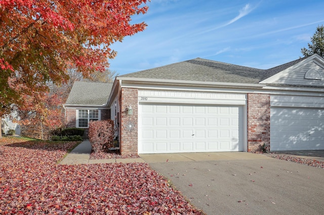 view of side of home featuring a garage