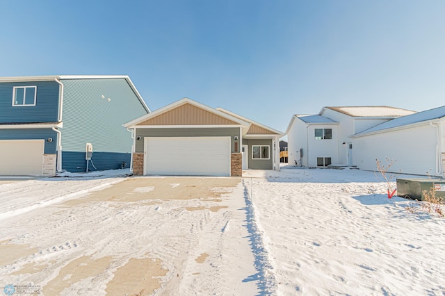 view of front of property with central air condition unit and a garage