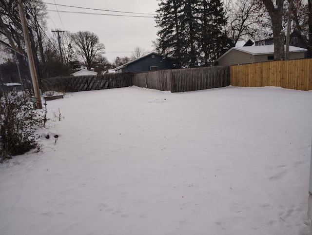 view of yard layered in snow