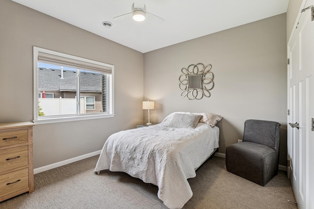 bedroom with light carpet and ceiling fan