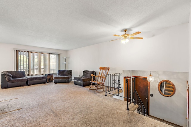 carpeted living room with a textured ceiling