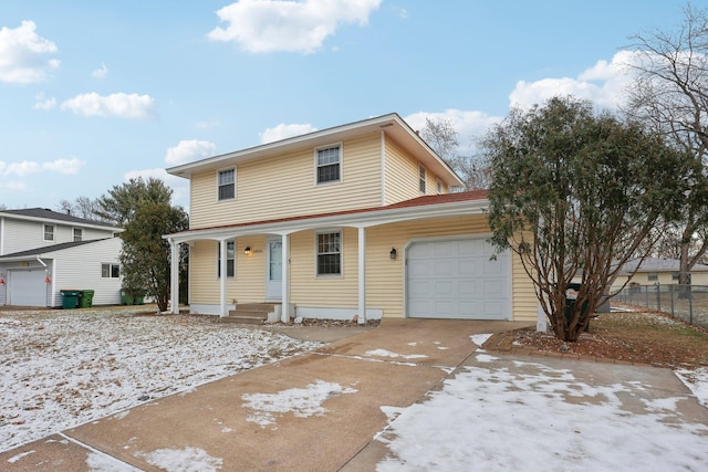 front facade with a porch and a garage