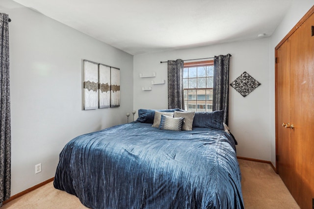 bedroom with light colored carpet