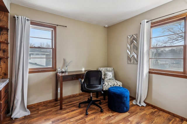 office area with wood-type flooring and plenty of natural light