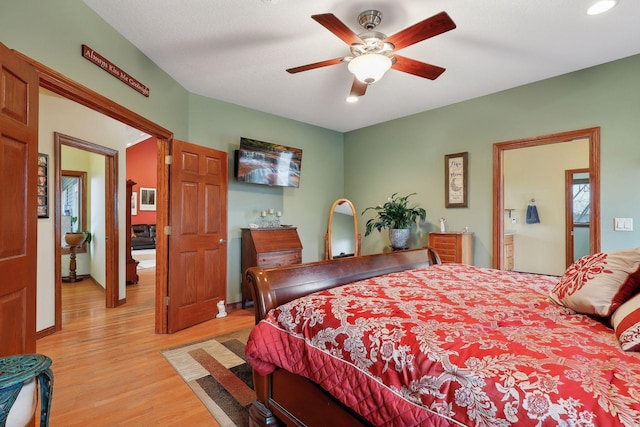 bedroom featuring ceiling fan and light hardwood / wood-style flooring