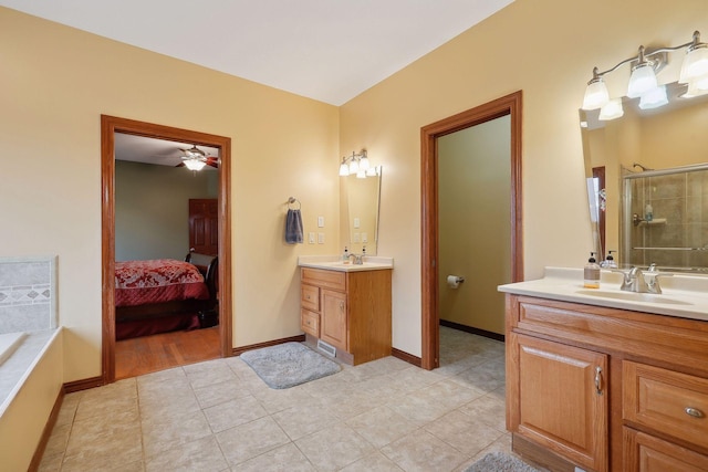 bathroom with vanity, tile patterned flooring, ceiling fan, and plus walk in shower