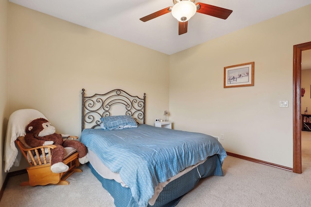 bedroom featuring ceiling fan and carpet