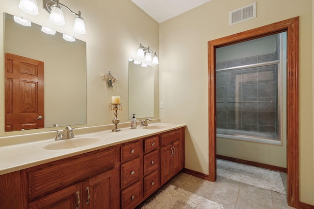 bathroom with vanity, shower / bath combination with glass door, and tile patterned floors