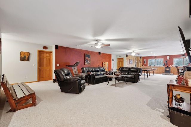 living room featuring ceiling fan and carpet