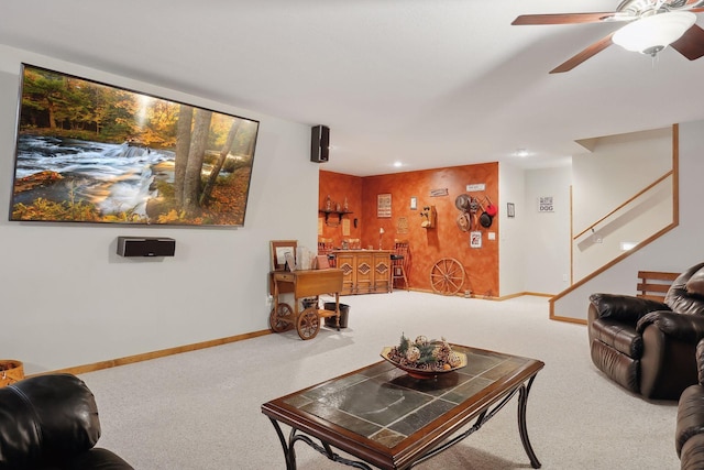 living room with ceiling fan and carpet