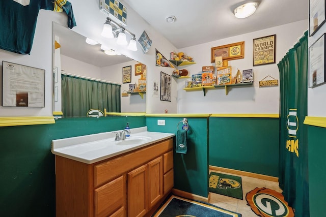 bathroom with tile patterned floors and vanity