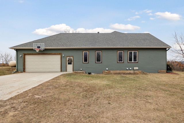 view of front of home with a garage and a front lawn