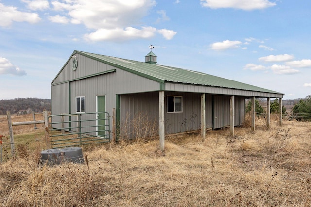 view of outbuilding featuring central air condition unit