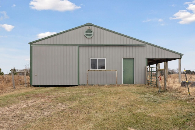 view of outbuilding featuring a lawn