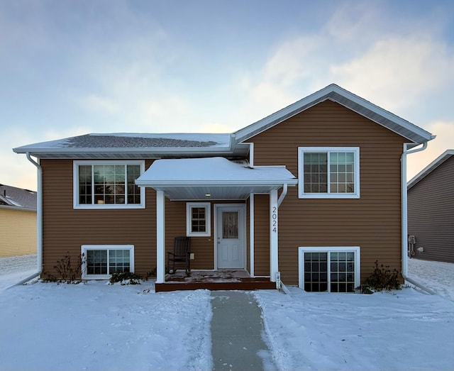 tri-level home featuring central air condition unit