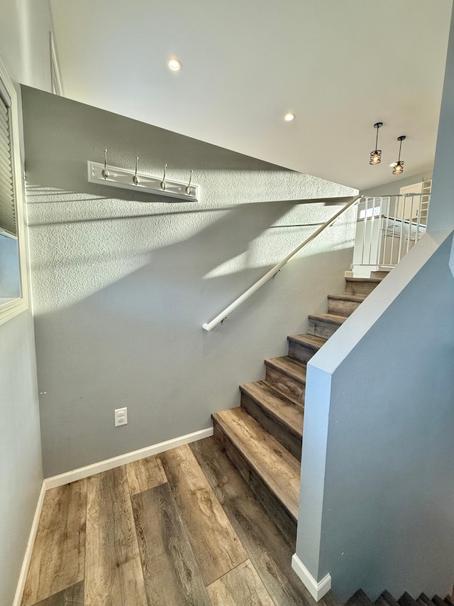 staircase featuring hardwood / wood-style floors