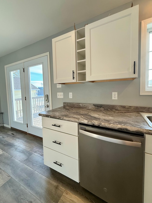 kitchen featuring white cabinetry, stainless steel dishwasher, and dark hardwood / wood-style floors