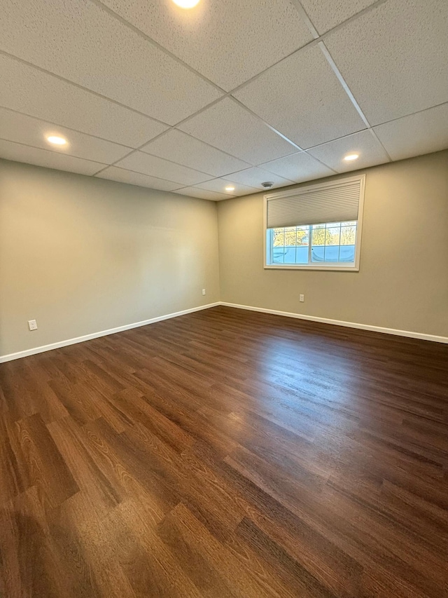 unfurnished room with a drop ceiling