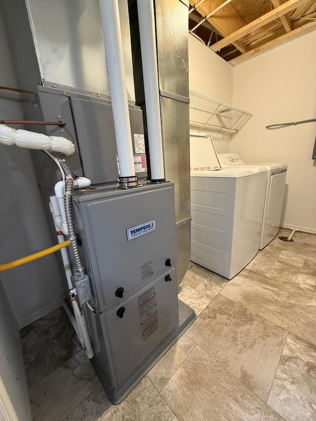 utility room with washer and clothes dryer