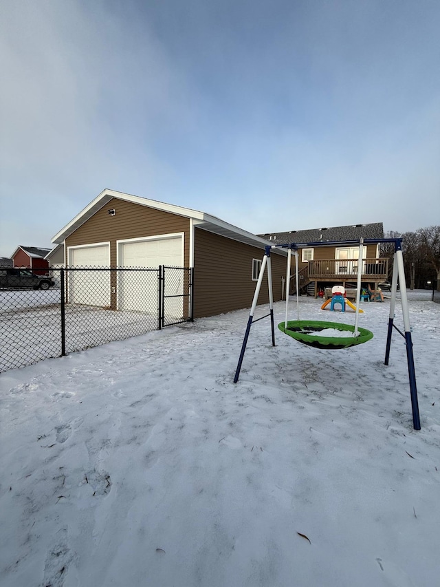 view of front of property with a wooden deck and a playground