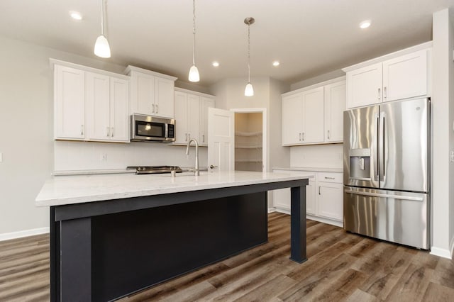 kitchen with white cabinetry and appliances with stainless steel finishes