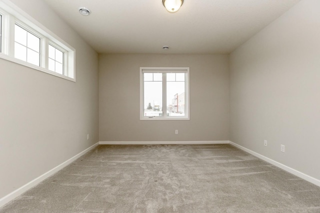 spare room with light carpet