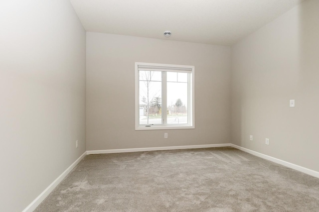 empty room with light colored carpet