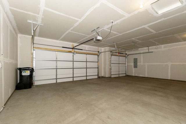 garage featuring a garage door opener and electric panel