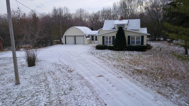 view of front of property featuring an outbuilding and a garage