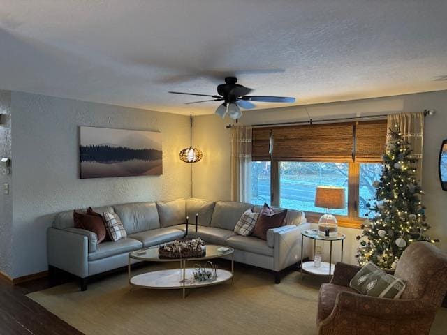 living room with hardwood / wood-style floors and ceiling fan