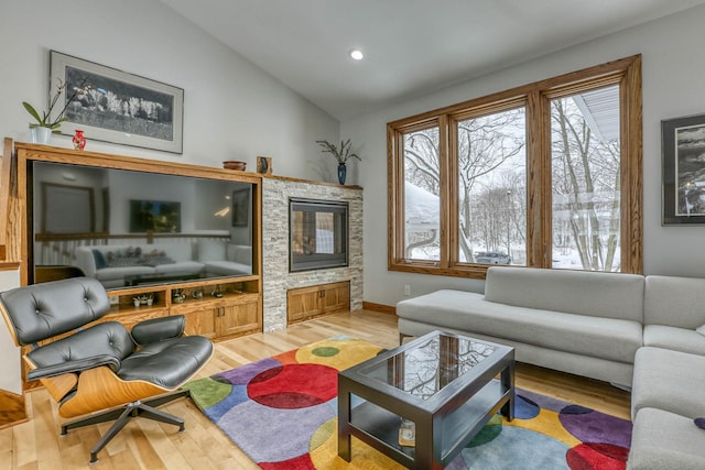 5517 Dickson Rd, Minnetonka, MN 55345 - living room with light wood-type flooring, healthy amount of natural light, lofted ceiling, recessed lighting, and baseboards