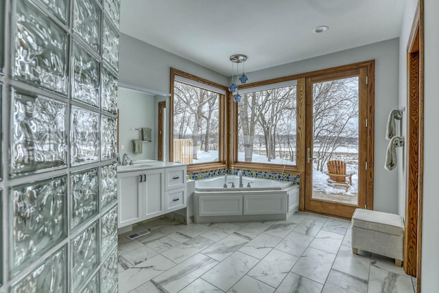 5517 Dickson Rd, Minnetonka, MN 55345 - bathroom with marble finish floors, a bath, and vanity
