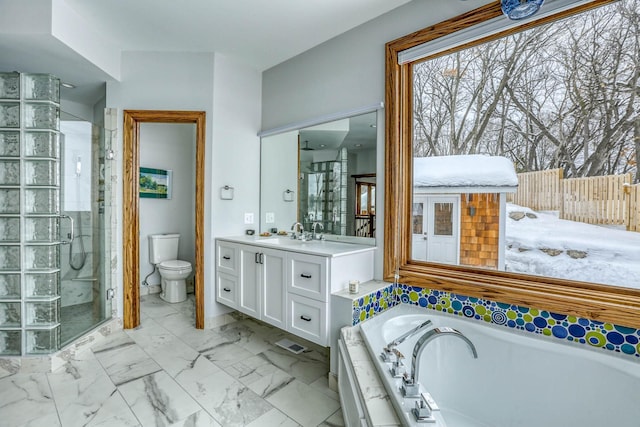 5517 Dickson Rd, Minnetonka, MN 55345 - bathroom featuring a stall shower, a garden tub, vanity, and toilet