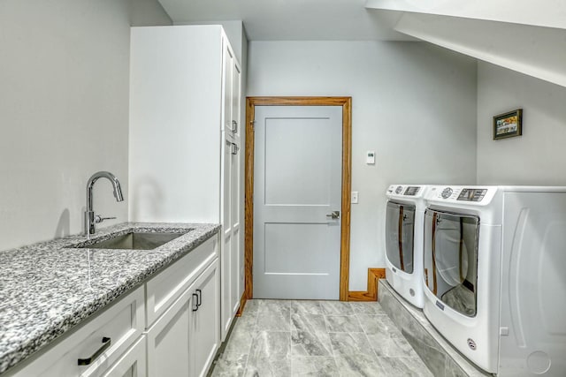 5517 Dickson Rd, Minnetonka, MN 55345 - laundry area featuring cabinet space, light marble finish flooring, and washer and dryer