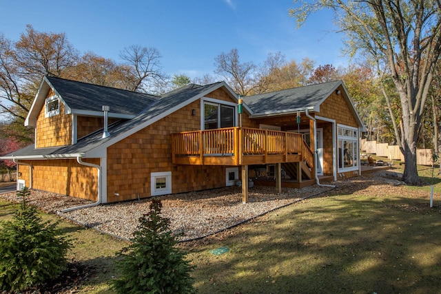 5517 Dickson Rd, Minnetonka, MN 55345 - back of house featuring a deck, a shingled roof, and a lawn