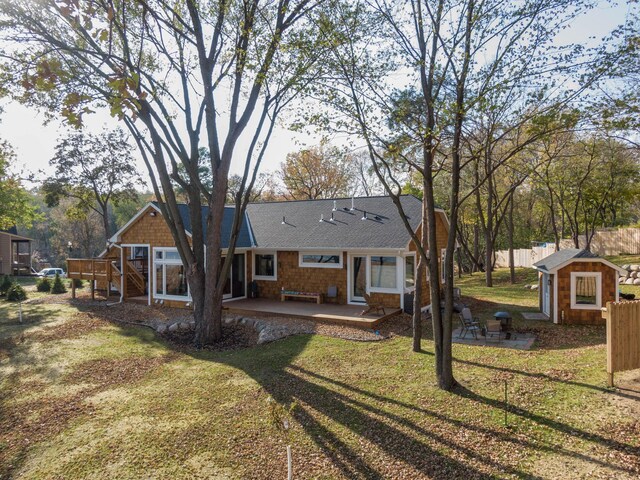 5517 Dickson Rd, Minnetonka, MN 55345 - rear view of house featuring a patio, a shingled roof, a deck, and stairs