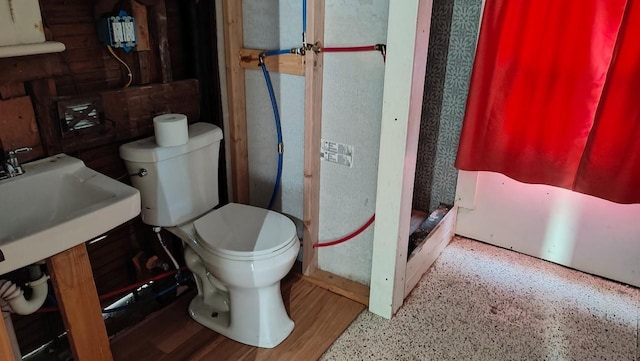 bathroom with toilet and walk in shower