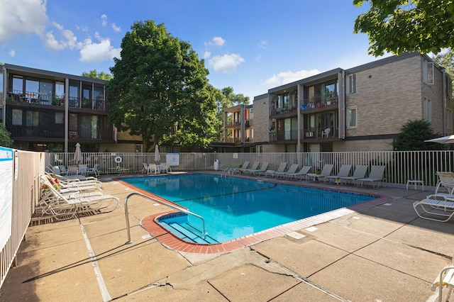 view of swimming pool featuring a patio