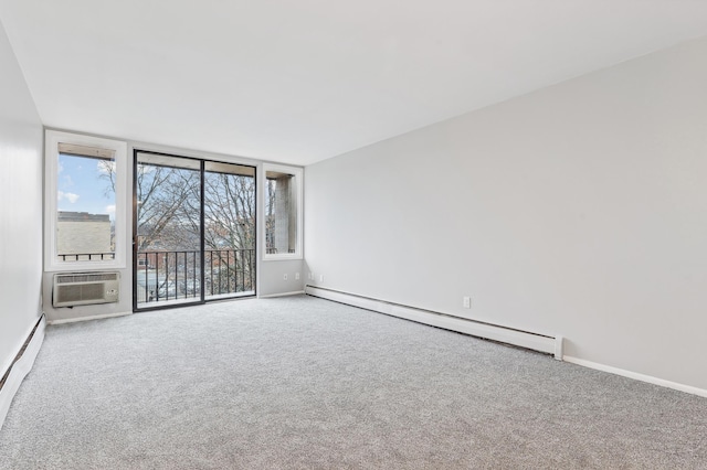 carpeted empty room featuring an AC wall unit and baseboard heating