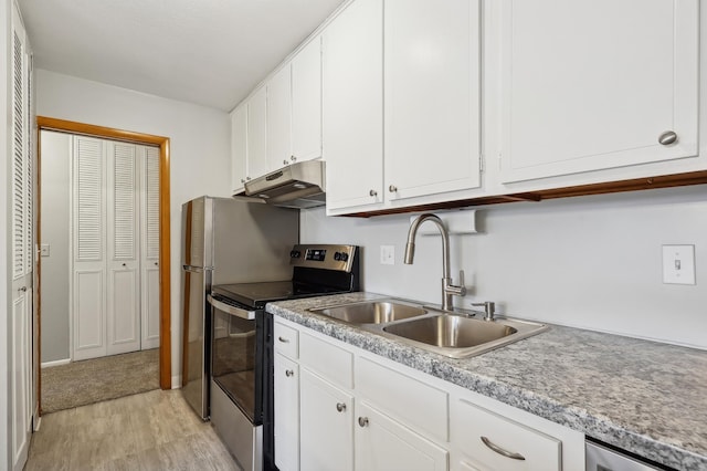 kitchen with stainless steel electric stove, white cabinets, sink, and light hardwood / wood-style flooring