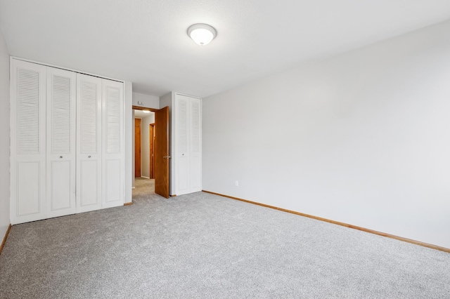 unfurnished bedroom with carpet flooring