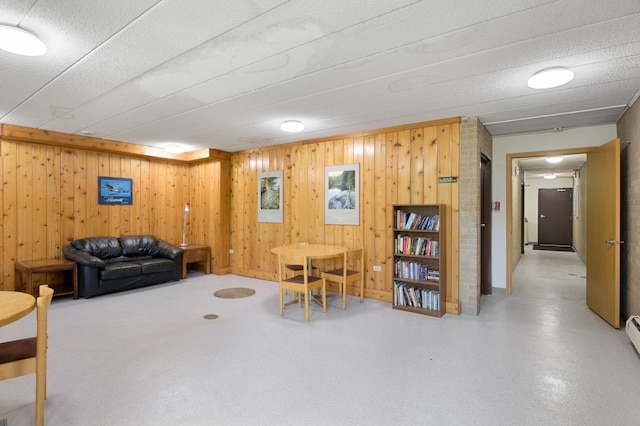 living room featuring wood walls