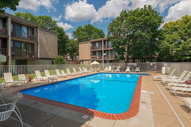 view of swimming pool with a patio area