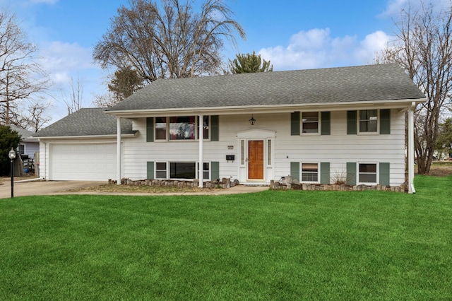 bi-level home with a front lawn, driveway, roof with shingles, and an attached garage